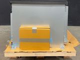 the box is sitting on the pallet next to the box