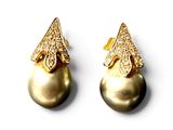 pair of pearl and diamond earrings on a white background