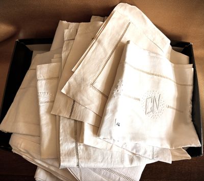 many white napkins in a black box on a table