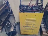 a machine that is sitting on the floor next to other machines