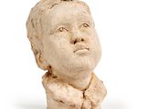 statue of a child ' s head on a white background