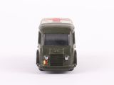 a toy truck that is sitting on a white surface