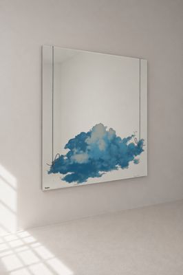 un tableau accroché au mur dans une pièce blanche