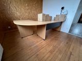 a desk with boxes on top of it in a room