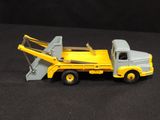 a toy truck that is sitting on a black surface