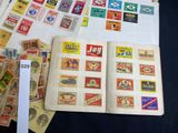 many different types of stamps on the pages of a book