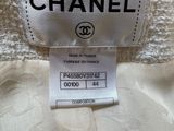 a label on a chanel dress with a white background