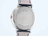 an image of a close up of a wrist watch on a white surface