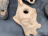 several pieces of pottery sitting on top of a table next to each other