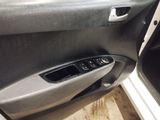 the interior of a car with the door open and the door handle open