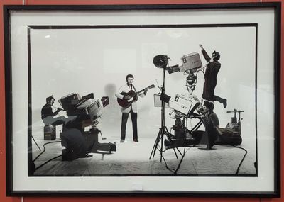 black and white photograph of a group of people playing instruments