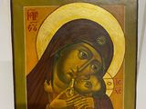 an icon of the mother and child is on display in a museum