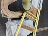 a yellow ladder that has a horn on top of it