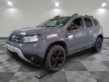 a picture of a grey dacia parked on a checkered floor