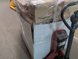 a dolly truck with a large box on it in a warehouse