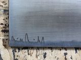 a picture of a knife on a piece of wood