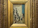 an image of a painting of a street scene in a gold frame