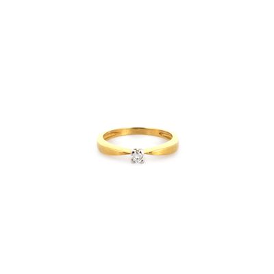 a yellow gold ring with a single diamond