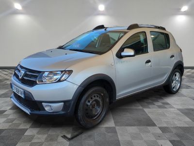 the silver dacia is parked in a room with a checkered floor