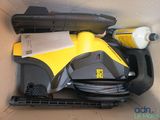 a box with a vacuum and other items in it