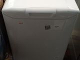a white washer and dryer sitting on the floor