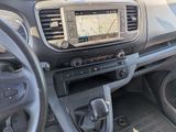 a dashboard of a car with a gps device in it
