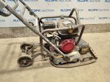 a small machine that is sitting on the ground