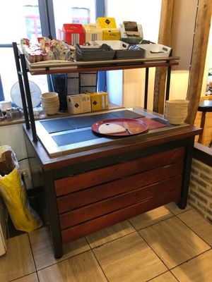 a kitchen with a sink and a counter in it