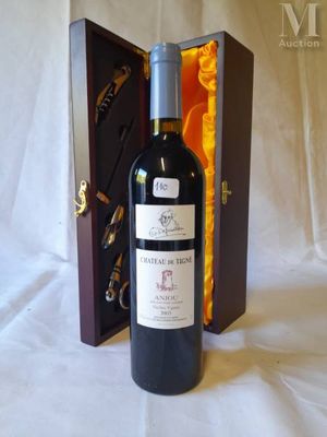 a bottle of wine in a wooden case on a table