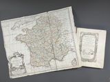 an old map of france with a book open to show a map