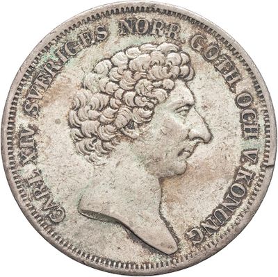 a close up of a coin on a white background