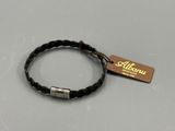 a black leather bracelet with a silver clasp and a tag