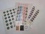some stamps and stamps are sitting on top of a table