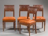 three chairs with leather upholstered backs and a wooden frame
