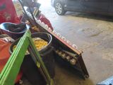 a pile of skis and ski poles in a garage