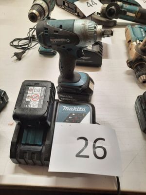 a lot of power tools on a table with a price tag