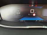 the dashboard of a car with a digital display on it