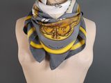 a close up of a mannequin torso with a scarf on it
