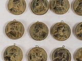 six antique medallions with portraits of people on them on a white surface