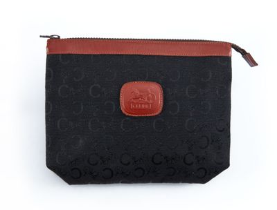 un sac à main noir et marron muni d'une poignée en cuir marron