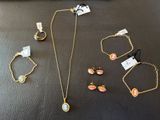 a collection of jewelry including a necklace, bracelet, and ring