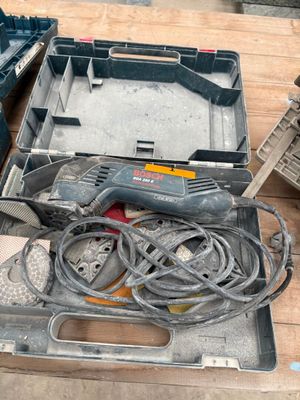 a tool box with tools on a wooden table