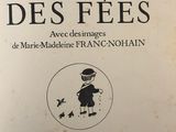 an old french book with a picture of a boy in a top hat