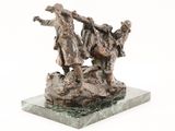 statue of a man and a woman on a rock with a dog