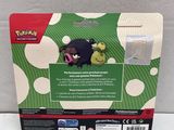 the box for the pokemon toy has a green and white pattern on it