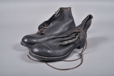 a pair of shoes that are tied up on a table