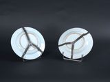 two plates that have been decorated with a peace sign on them