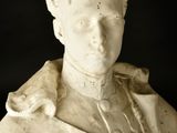 marble bust of a young man with a collared shirt on