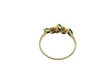 a close up of a gold ring with green stones on it