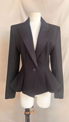 an image of a black jacket on a mannequin dummy